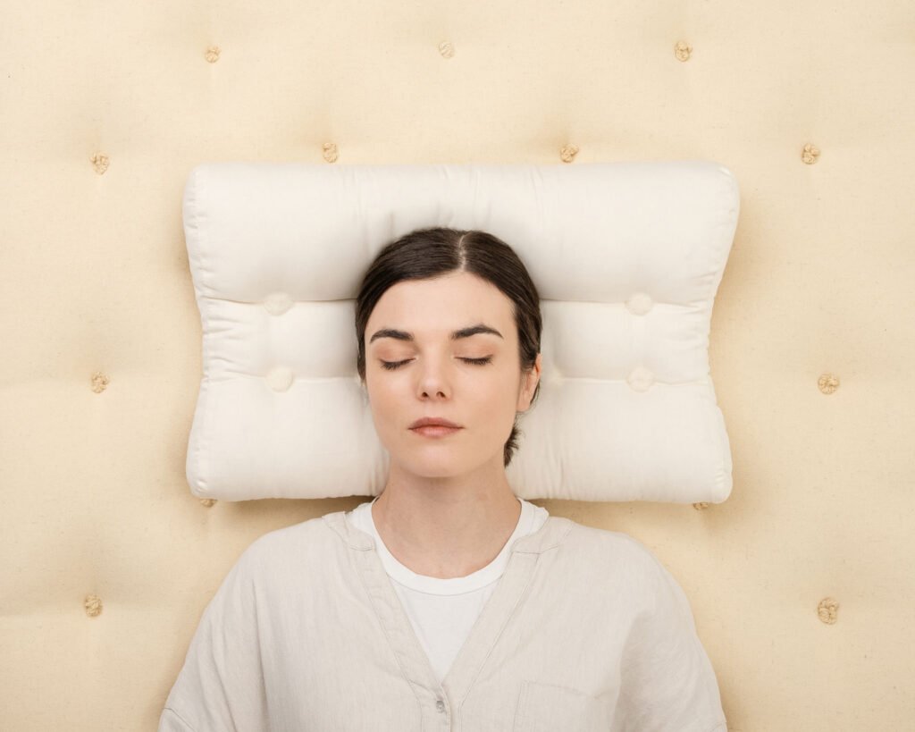 Ergonomic wool pillow with contoured shape