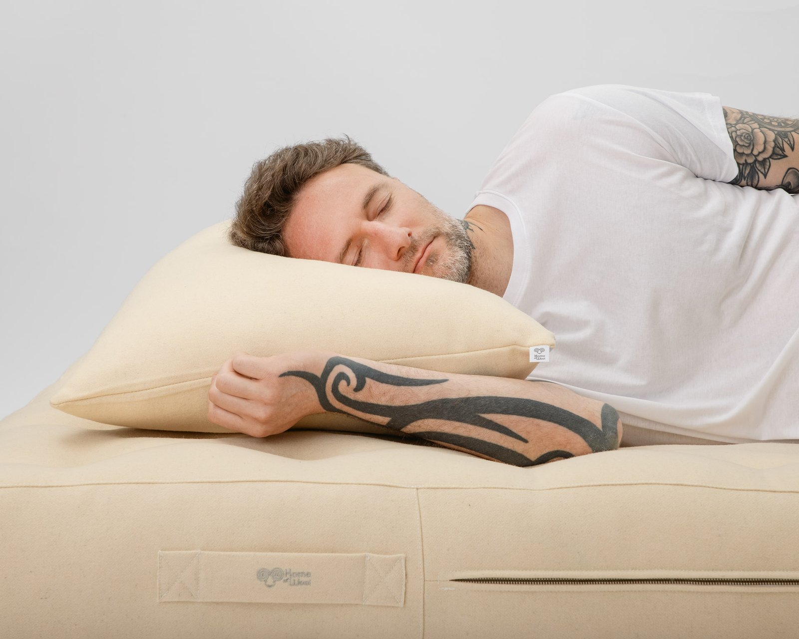 Wool pillow in natural cotton casing