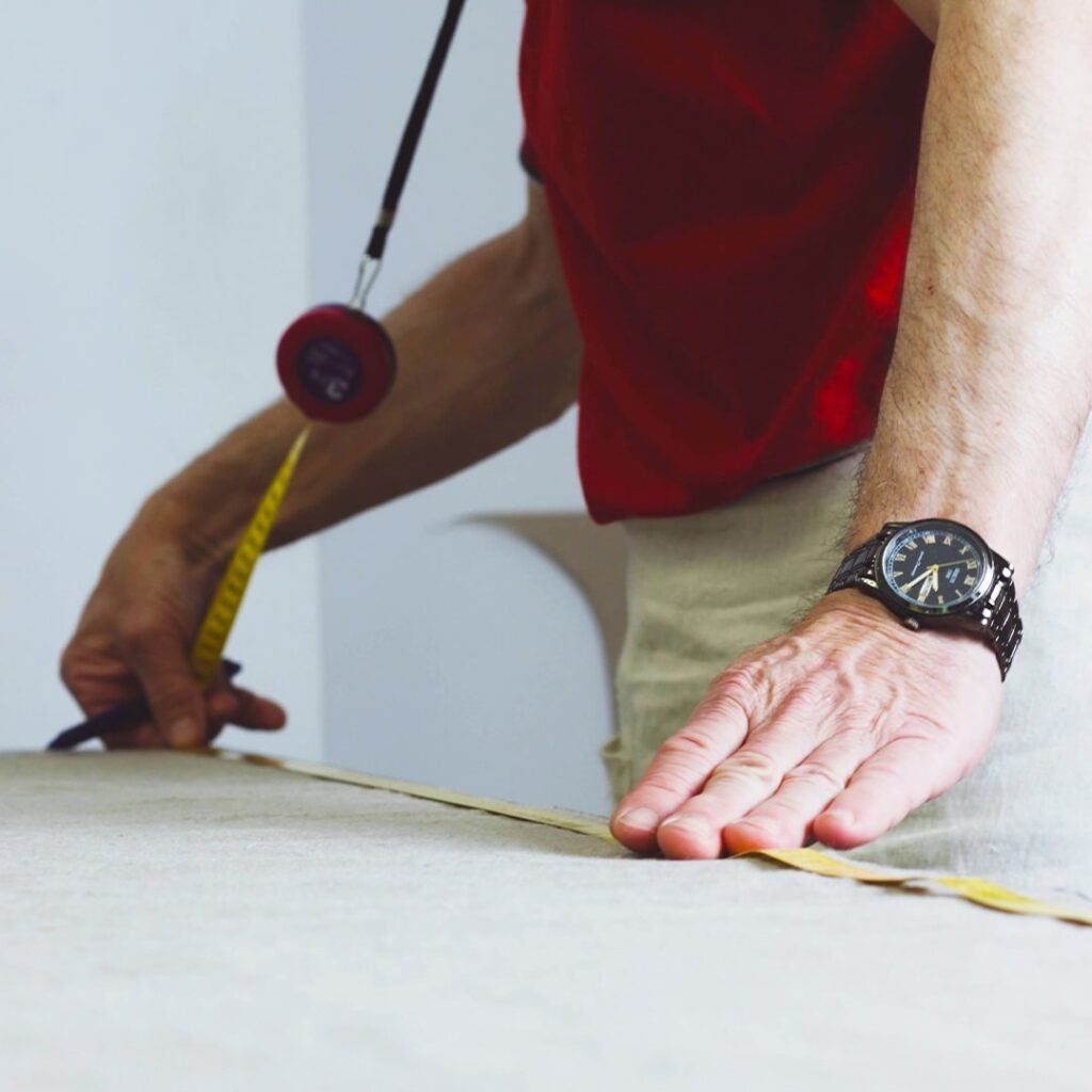 Measuring fabric by hand in the Home of Wool atelier